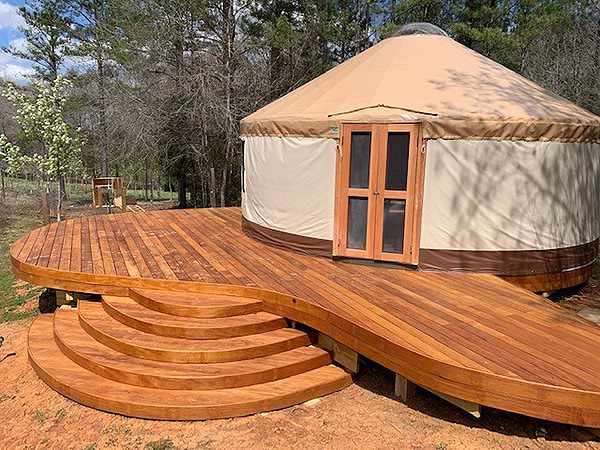 Custom yurt deck with surrounding outdoor space