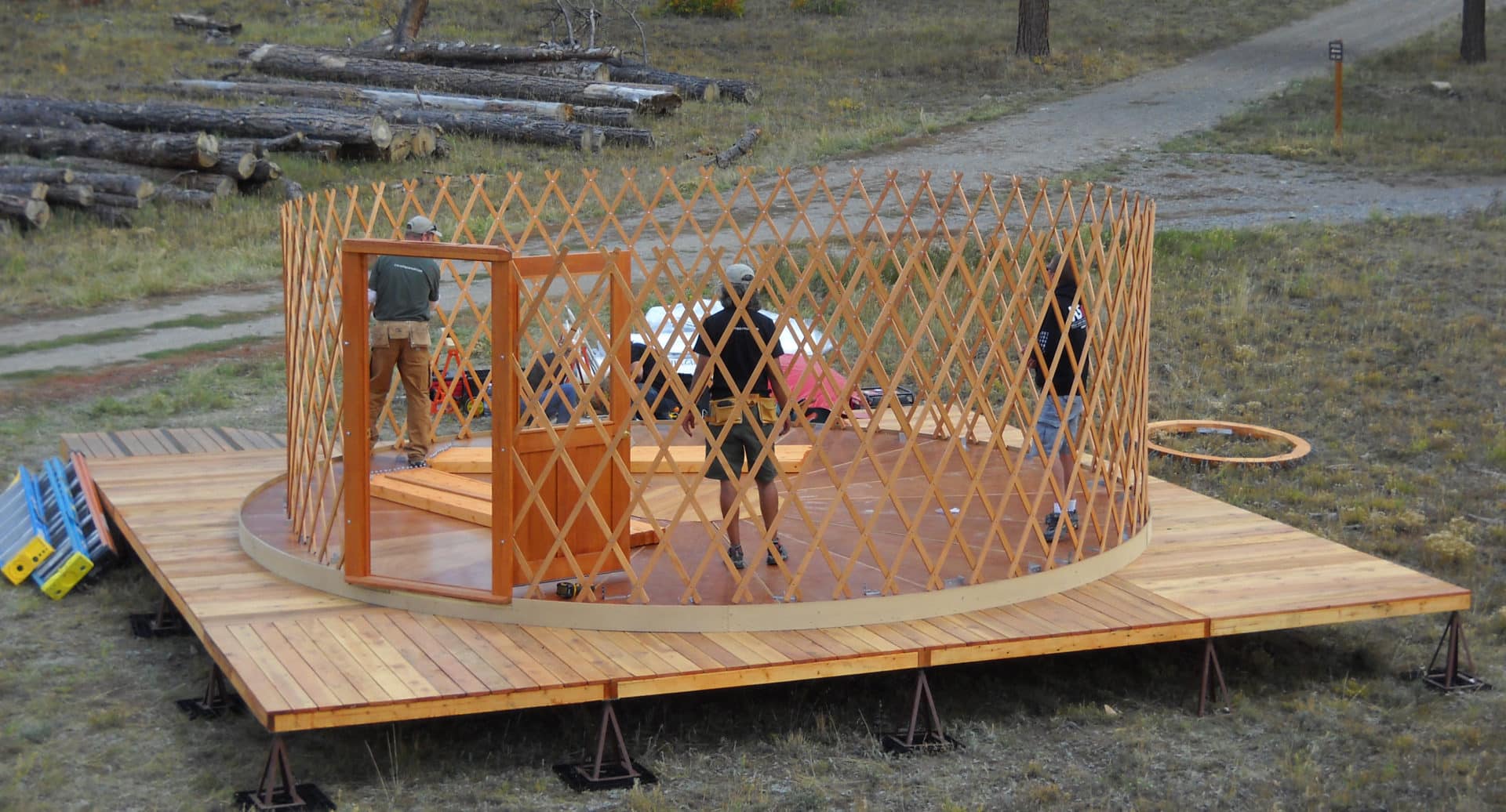 Extended wooden yurt deck with outdoor living area